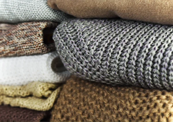 Two stacks of warm sweaters on a full background horizontal — Stock Photo, Image