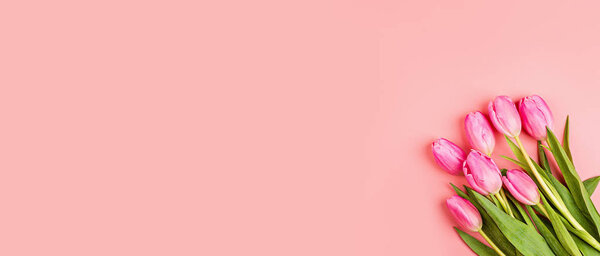 View from above tulips and gift box with copy space. Background for womens day, 8 March Valentines day, 14 february. Flat lay style, top view, mockup, template, overhead. Greeting card