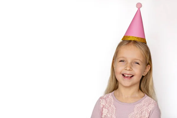 Small child in pink party hat on white background. Copy space, mockup, template — 스톡 사진