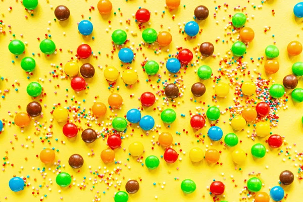 Multicolored Candy Dragees Yellow Background Top View Flat Lay Festive — Stock Photo, Image