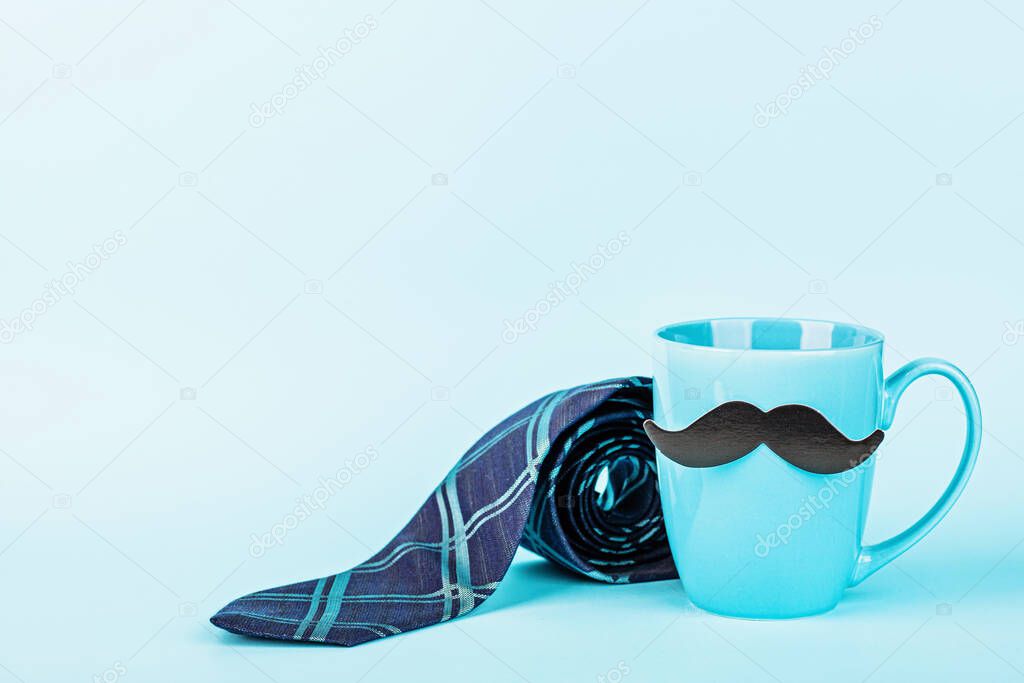 Happy Fathers Day background. gift box, coffee cup with funny moustache on blue table. mockup, template, greeting card, copy space.