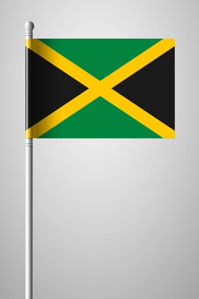 Bandera de Jamaica. Bandera Nacional en asta de bandera — Archivo Imágenes Vectoriales