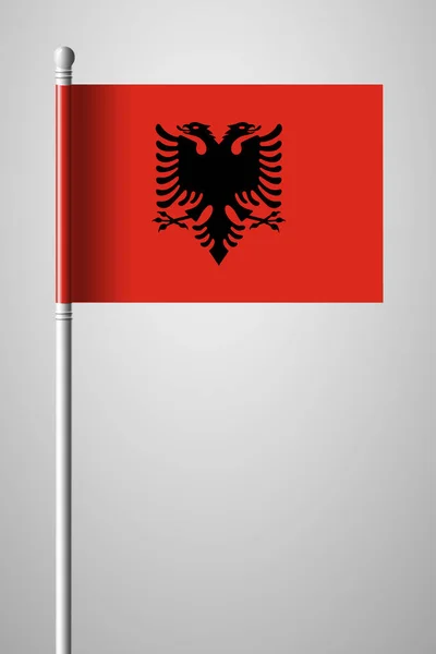 Флаг Албании. Флаг на флагштоке. Изолированное стратио — стоковый вектор
