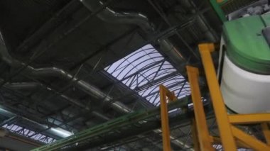 modern white cable transporter turns on green rails closeup