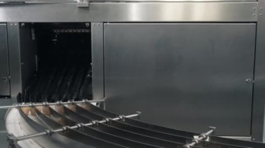 ice cream waffle cones arrive on rotating equipment in shop