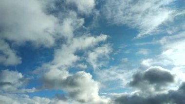 Clouds flying through the winter sky. Snow-carrying clouds driven by the wind through the cold winter sky.