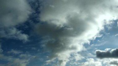 Clouds flying through the winter sky. Snow-carrying clouds driven by the wind through the cold winter sky.