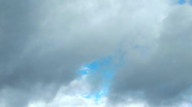 Clouds flying through the winter sky. Snow-carrying clouds driven by the wind through the cold winter sky.