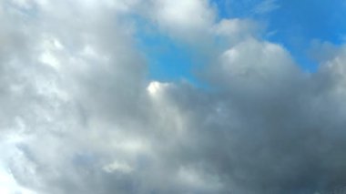 Clouds flying through the winter sky. Snow-carrying clouds driven by the wind through the cold winter sky.