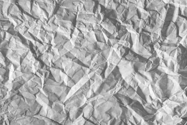 Işık tarafından vurgulanan buruşuk kağıt yüzeyine.