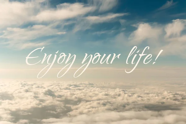 Inspirational motivation quote, enjoy life, on an abstract sky background
