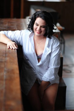 white shirt on the girl, mistress of life, self-confidence, wooden floor, talk about sex,intimate atmosphere,sexual problems,topic for adults,women's conversations,sexual experience  clipart
