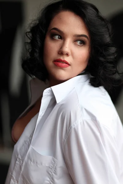 Portrait brunette in a white shirt,relationship with a man,bright appearance — Stock Photo, Image