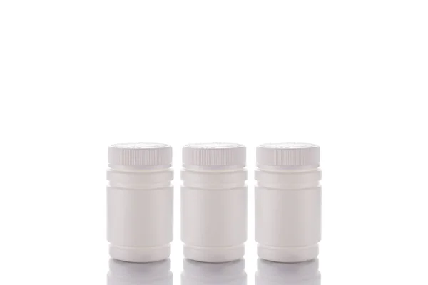 Trois Pots Pilules Couvercle Fermé Tiennent Sur Une Surface Miroir — Photo