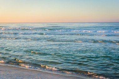 Waves in the Gulf of Mexico at sunrise, in Panama City Beach, Fl clipart