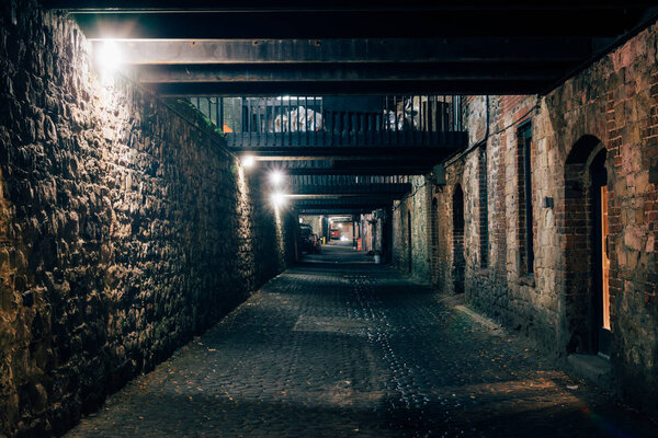 Dark alley at night in Savannah, Georgia.