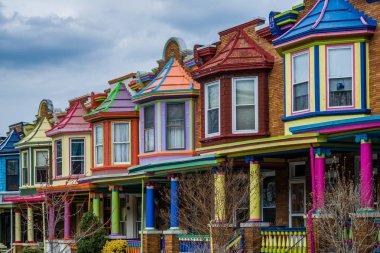 Colorful row houses along Guilford Avenue in Charles Village, Ba clipart