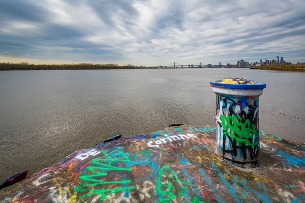 Graffiti and the Delaware River at Graffiit Pier in Philadelphia