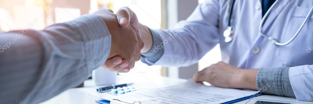 Medicine healthcare and trust concept, doctor shaking hands with