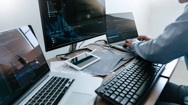 Programmer working On Computer In IT Office Typing Data Coding i
