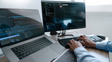 Programmer working On Computer In IT Office Typing Data Coding i