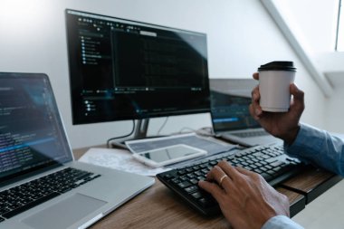 Programmer working On Computer In IT Office Typing Data Coding i