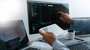 Programmer Typing Code on desktop computer, Developing programmi