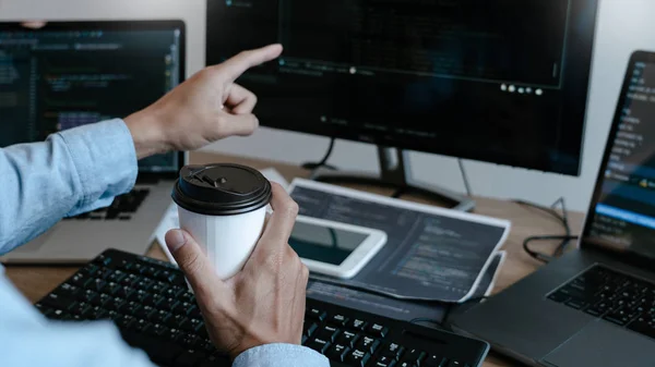 Programmer Typing Code on desktop computer, Developing programmi — ストック写真