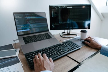 Programmer working On Computer In IT Office Typing Data Coding i