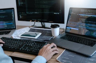 Programmer working On Computer In IT Office Typing Data Coding i