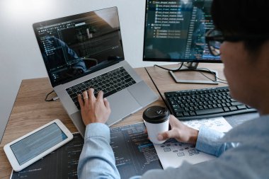 Programmer working On Computer In IT Office Typing Data Coding i