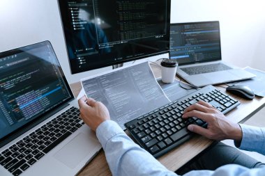 Programmer working On Computer In IT Office Typing Data Coding i