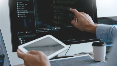 Programmer working On Computer In IT Office Typing Data Coding i