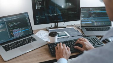 Programmer working On Computer In IT Office Typing Data Coding i