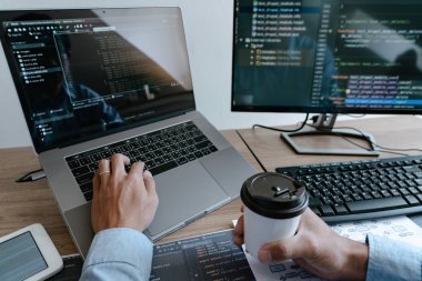 Programmer working On Computer In IT Office Typing Data Coding i