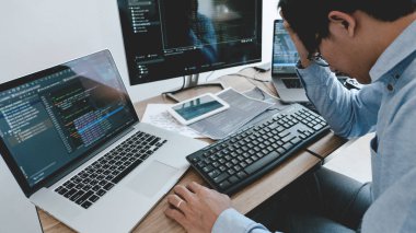 Programmer working On Computer In IT Office Typing Data Coding i