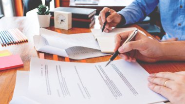 tutor and college students teaching school work and explaining p