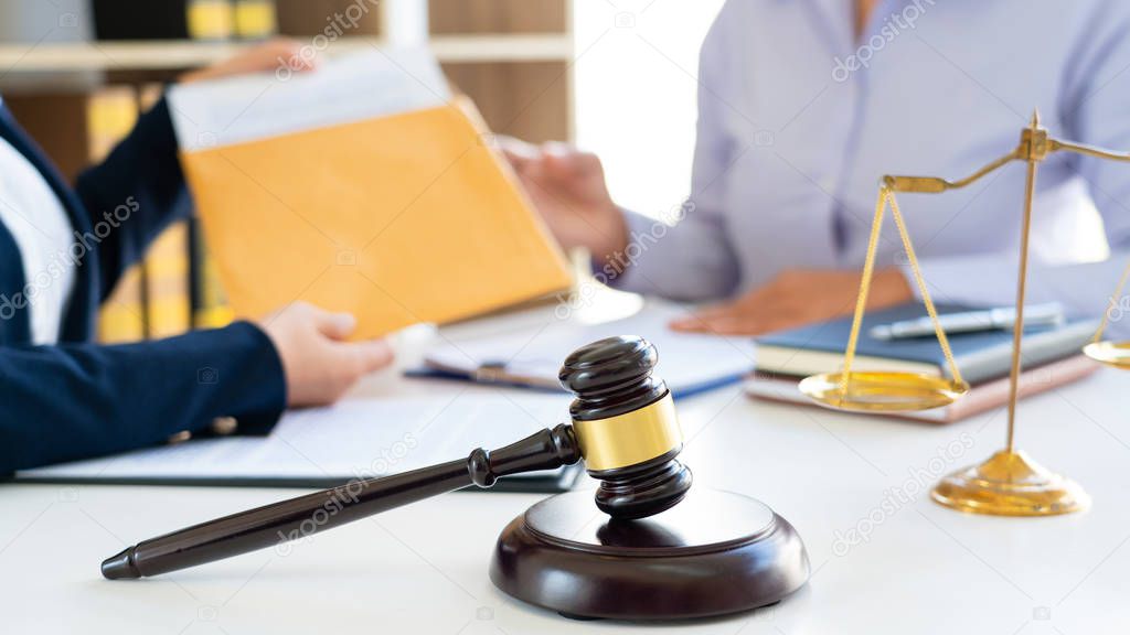 Women lawyer discussing with clients in courtroom. justice and law ,attorney, court judge, meeting concept.