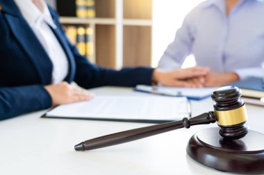 women attorney or lawyer provide holding hands to Consoling with