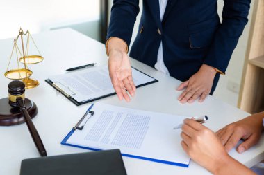 Female Lawyer explaining legal situation and discussing with con