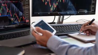 Businessman broker Analyzing finance data graphs and reports on 