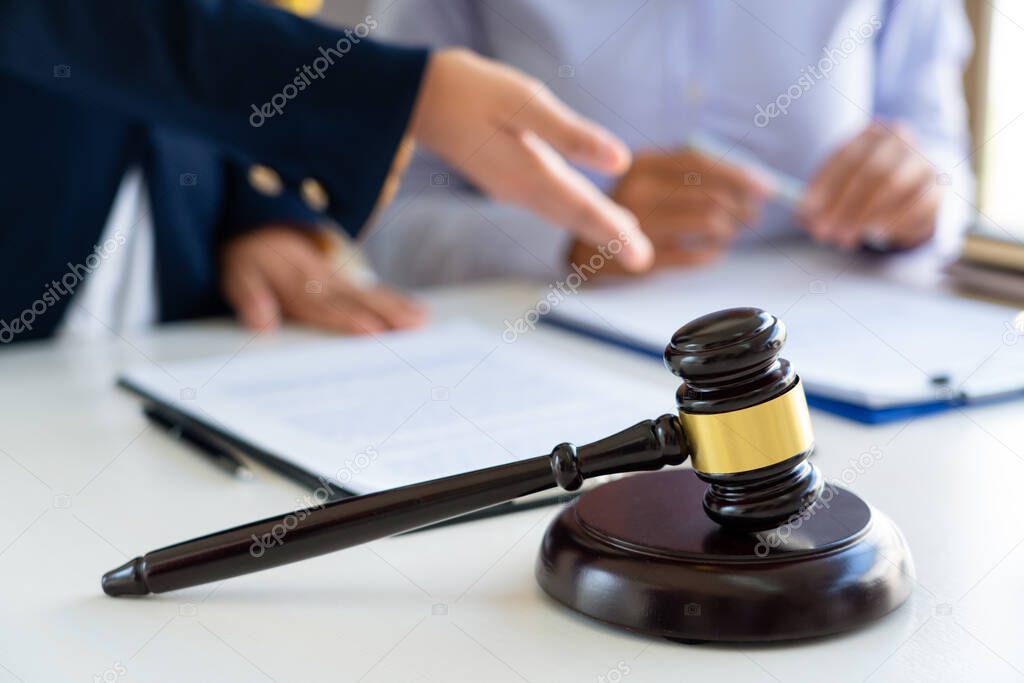 Women lawyer discussing with clients in courtroom. justice and law ,attorney, court judge, meeting concept.