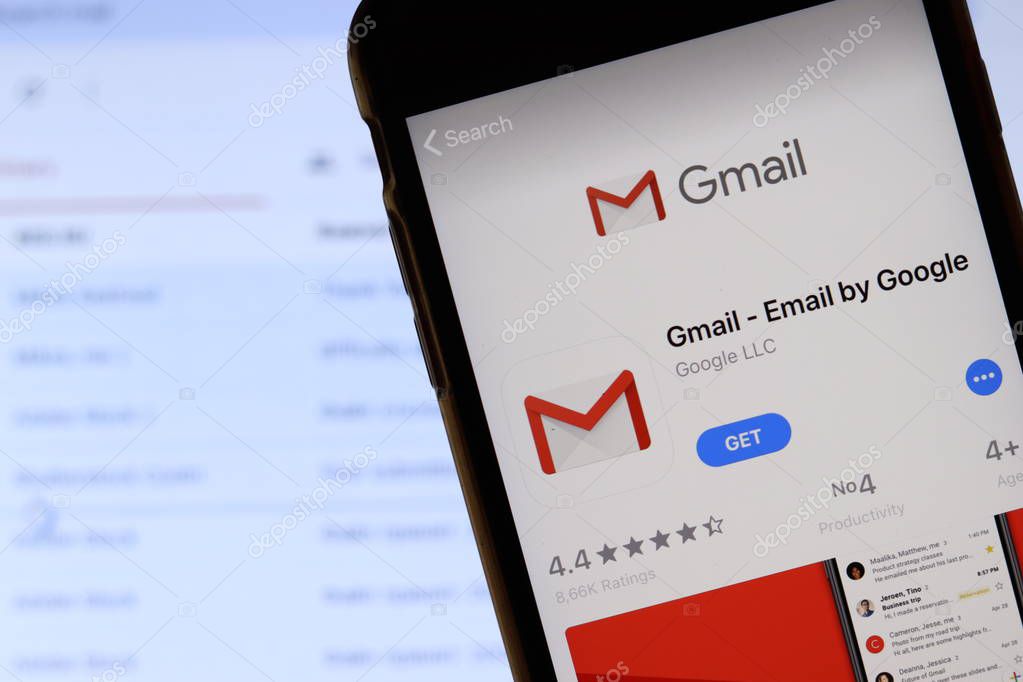 Mobile phone with Gmail icon on screen app store logo close up with website on laptop. Blurred background. Los Angeles, California, USA - 9 November 2019, Illustrative Editorial