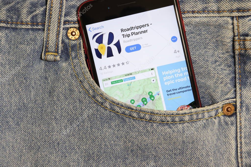 Los Angeles, California, USA - 5 December 2019: Roadtrippers Trip Planner app icon on phone screen in blue jeans pocket. App Store logo on Iphone with light denim Background, Illustrative Editorial.