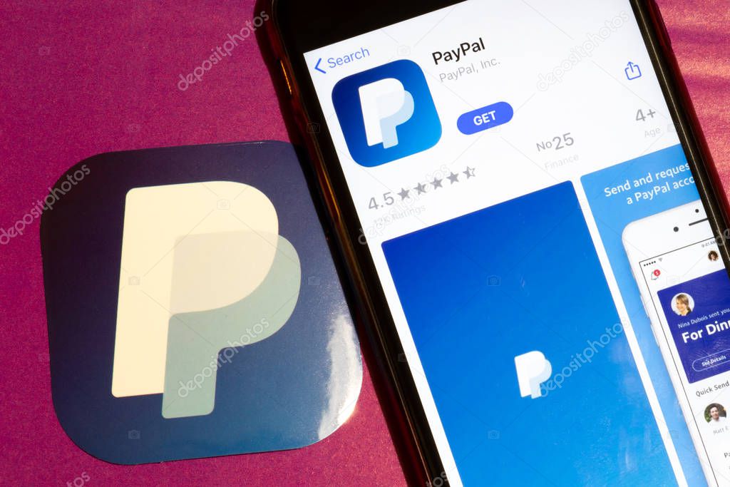 Los Angeles, California, USA - 22 January 2020: PayPal app logo and phone with icon close up on purple background, Illustrative Editorial.