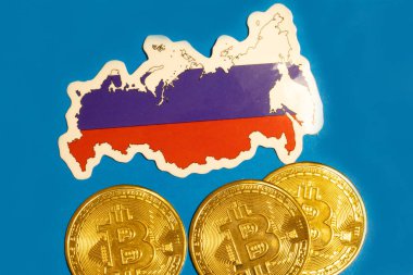 Russia Flag with Bitcoin flat lay for illustration. Cryptocurrency btc law concept