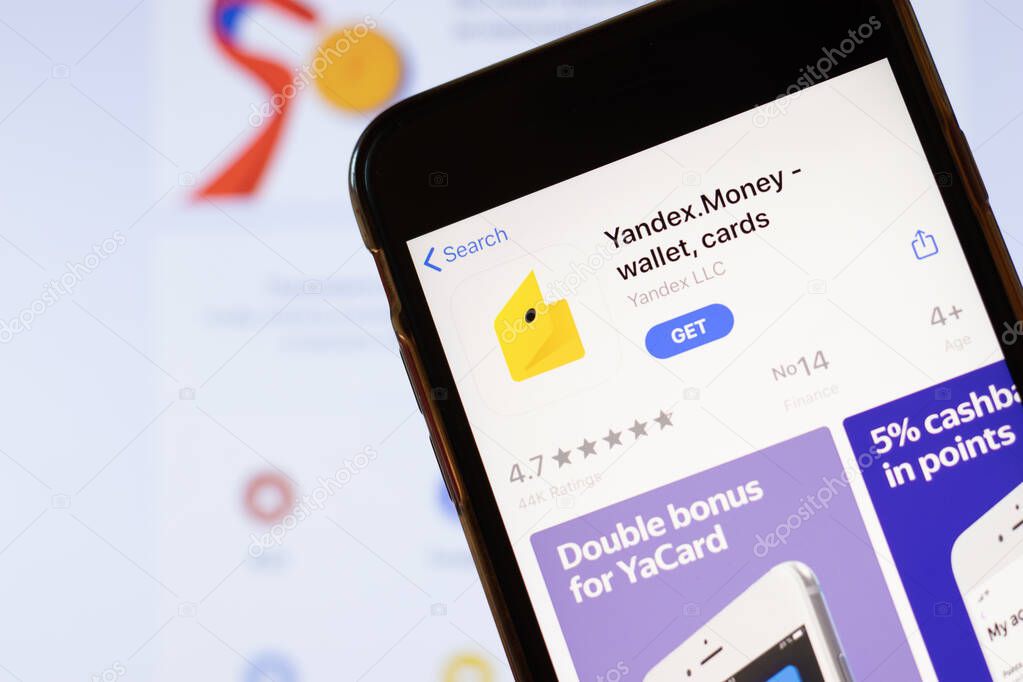 Los Angeles, California, USA - 24 March 2020: Yandex Money app logo on phone screen close up with website on background with icon, Illustrative Editorial.