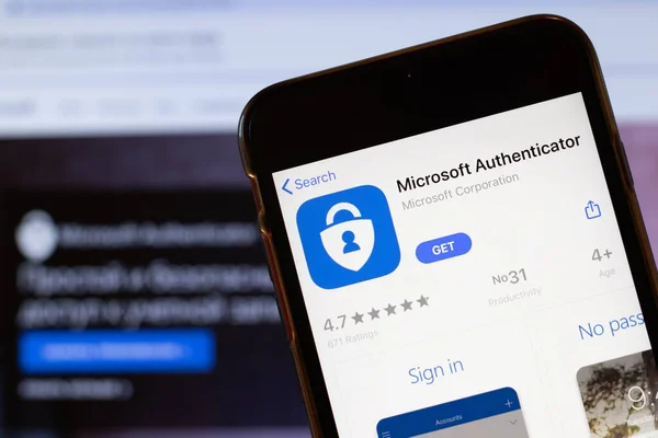 Los Angeles, California, ABD - 24 Mart 2020: Microsoft Authenticator uygulama logosu telefon ekranında arka planda ikon, Illustrative Editorial ile web sitesini kapatın.