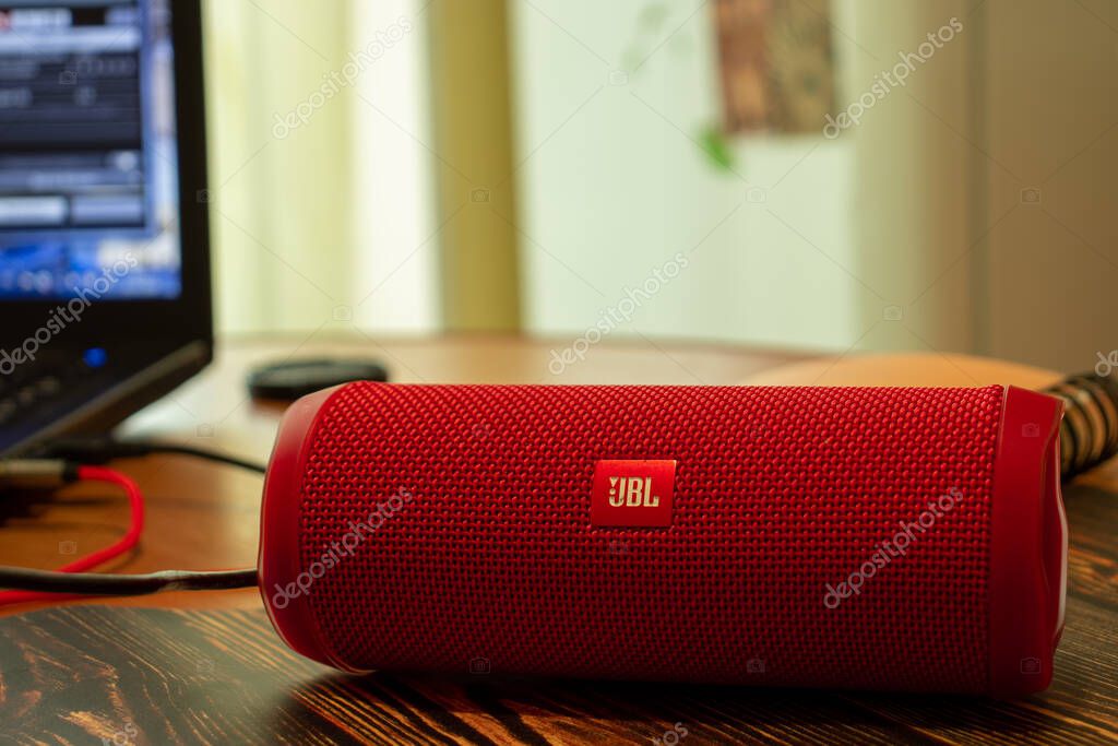 Los Angeles, California, USA - 16 April 2020: JBL Flip Bluetooth Wireless Speaker close-up on blurry background with laptop, Illustrative Editorial.