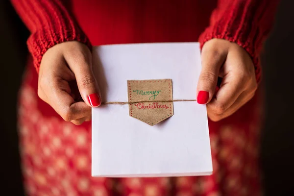 Girl giving Christmas Greeting Card — Stock Photo, Image
